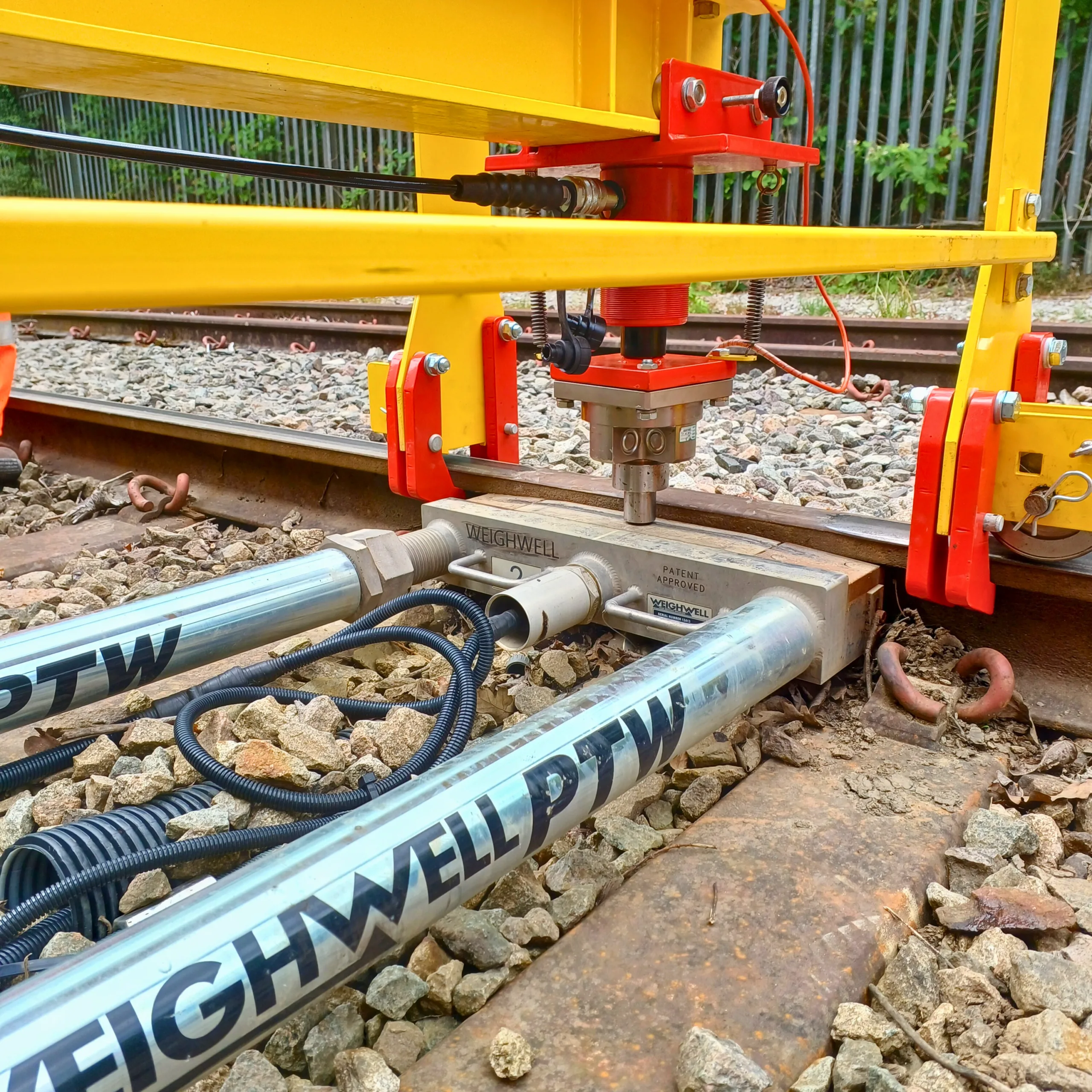 Portable train weighing system (PTW) being calibrated in-track