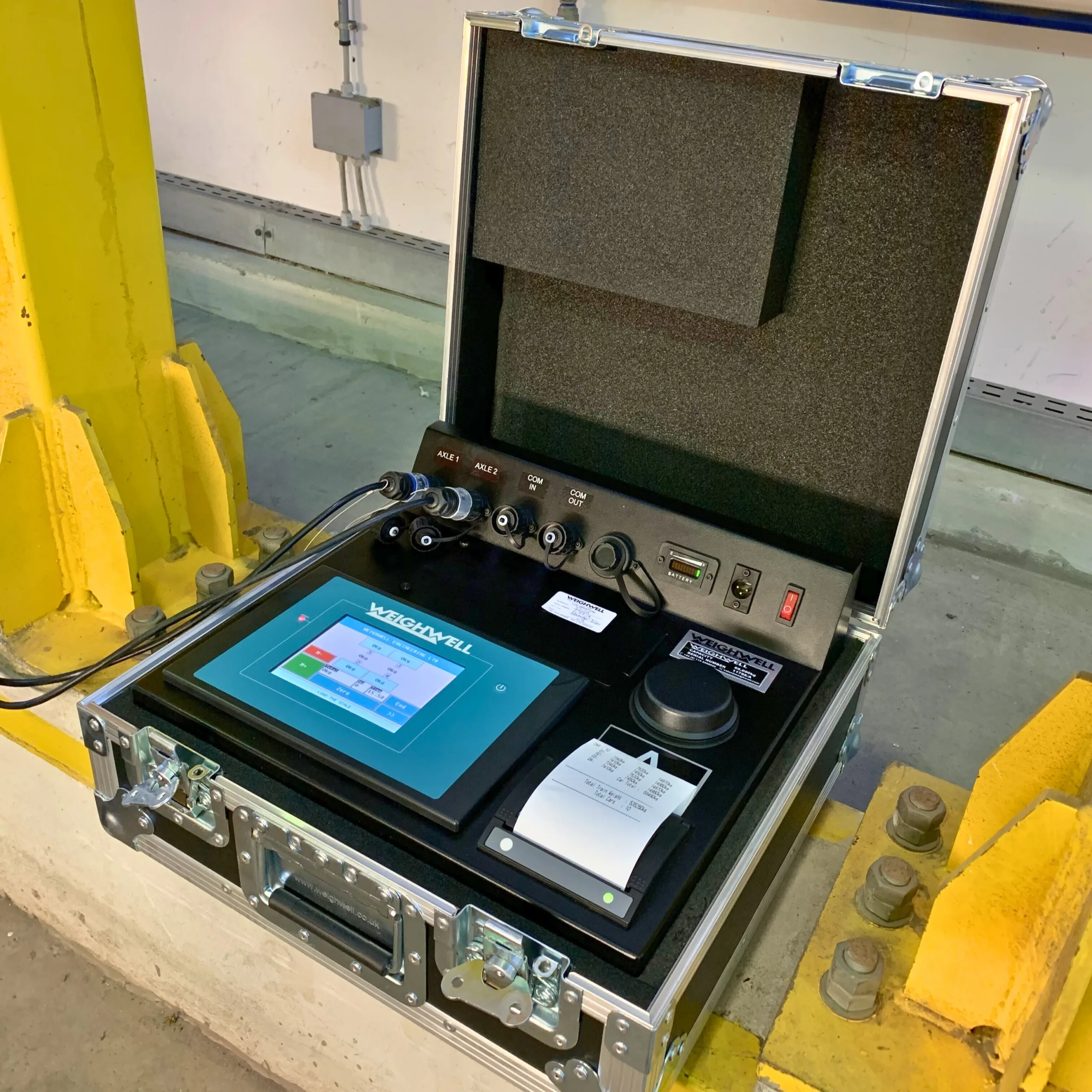 trusted-by Digital indicator for static train weighing installed inside maintenance depot.